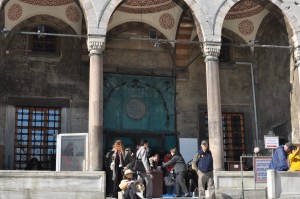 Taking off our shoes. There was also a basin, should anyone want to cleanse themselves (usually arms, feet, and head) before entering for worship.